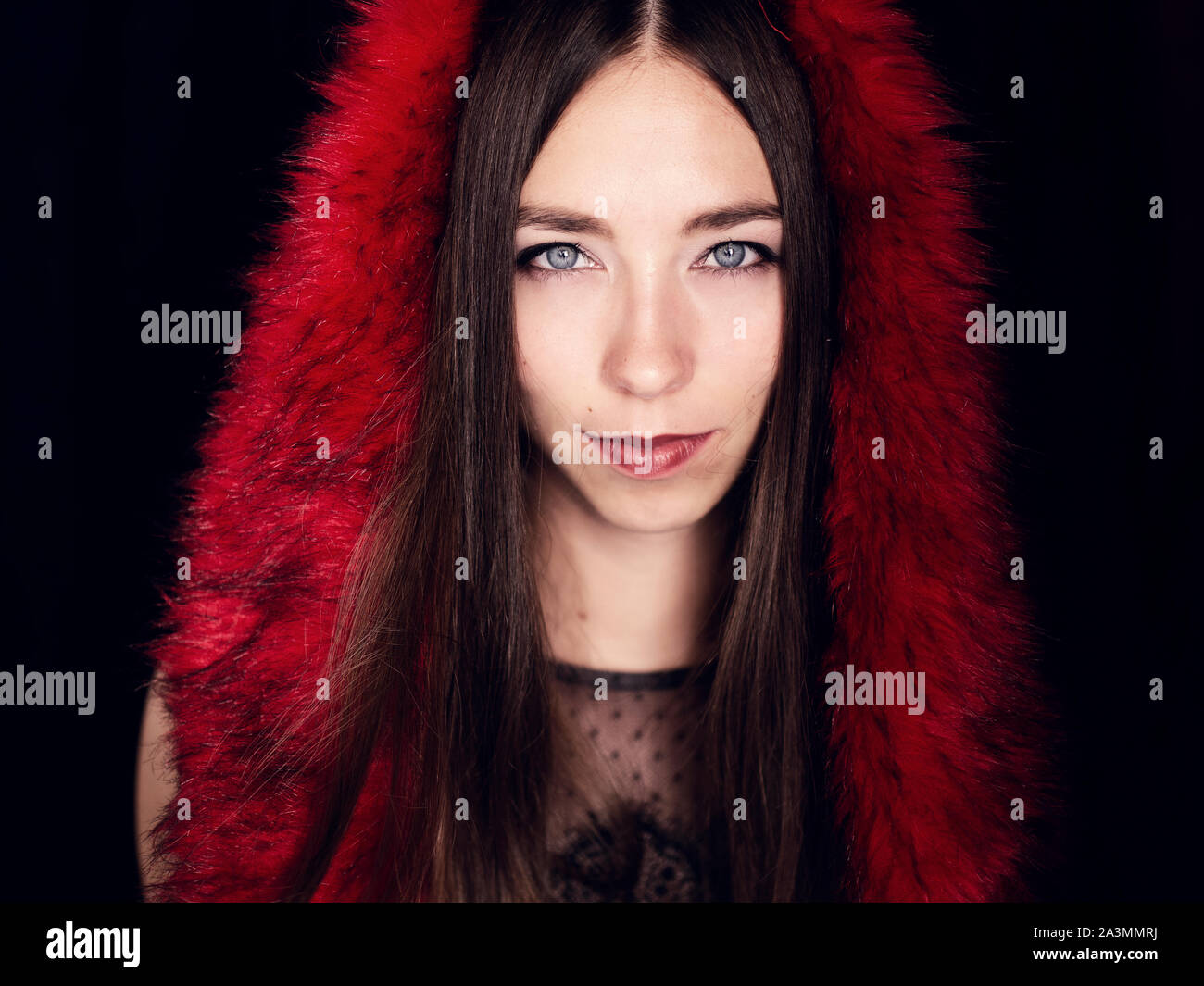 beautiful young Russian woman with blue eyes and brown hair wearing red