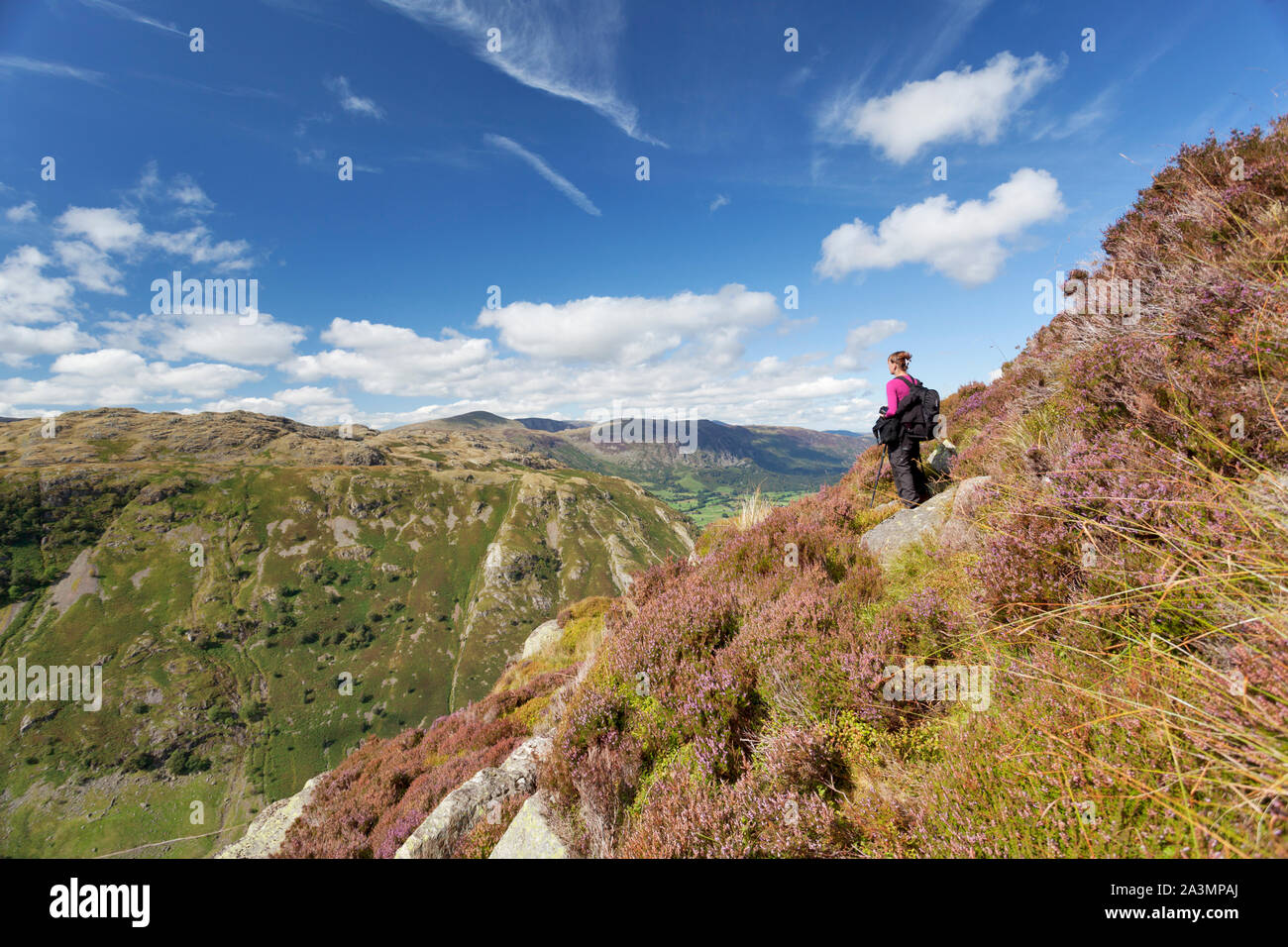 Woman hiking at Eagle Crag in the Lake District. Stock Photo