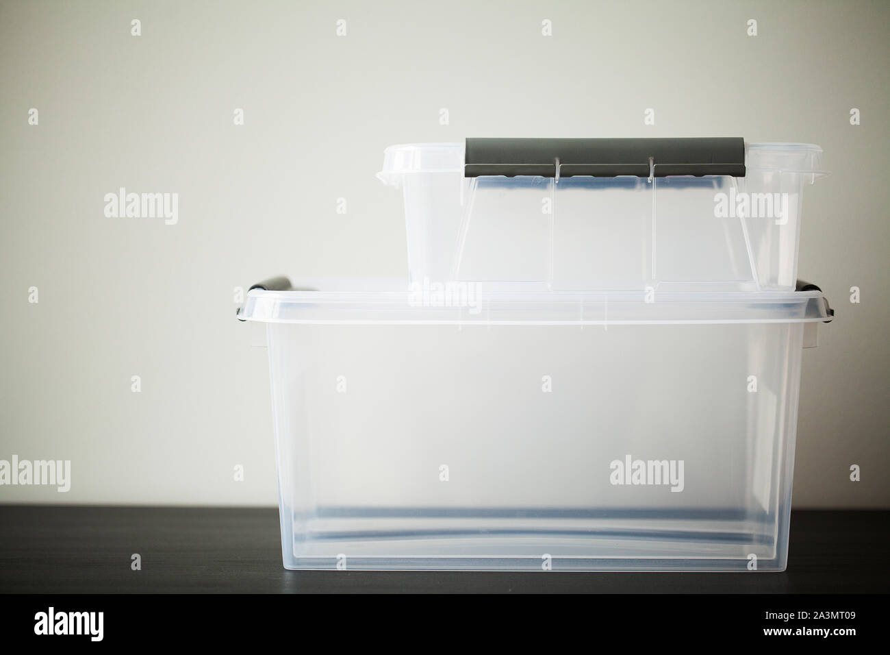 Transparent drawers for storing things on a wooden table Stock Photo