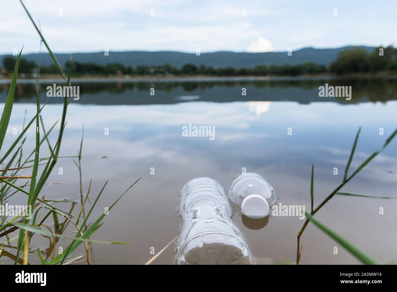 Plastic water bottles pollution in the river. Plastic trash in water