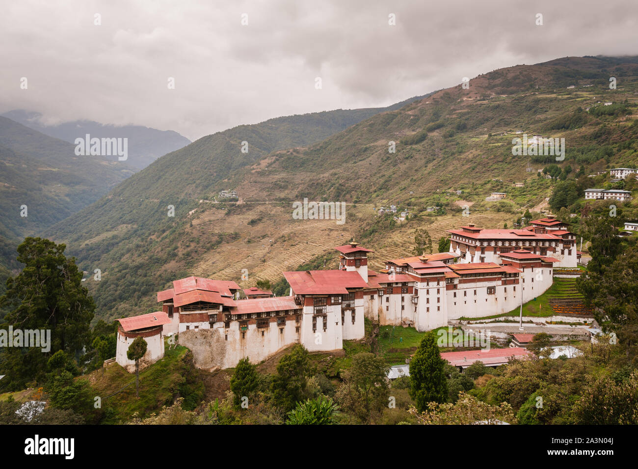 Bumthang, Bhutan, 06 Nov 2011: View of majestic Trongsa Dzong with mountain range in background. Stock Photo