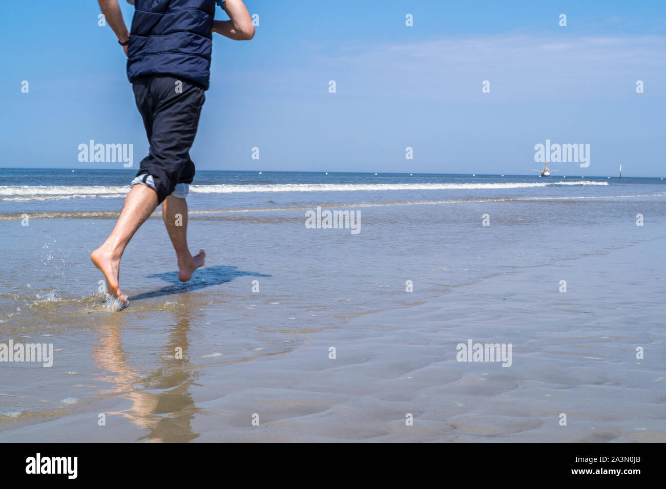 Jogging on the beach Stock Photo