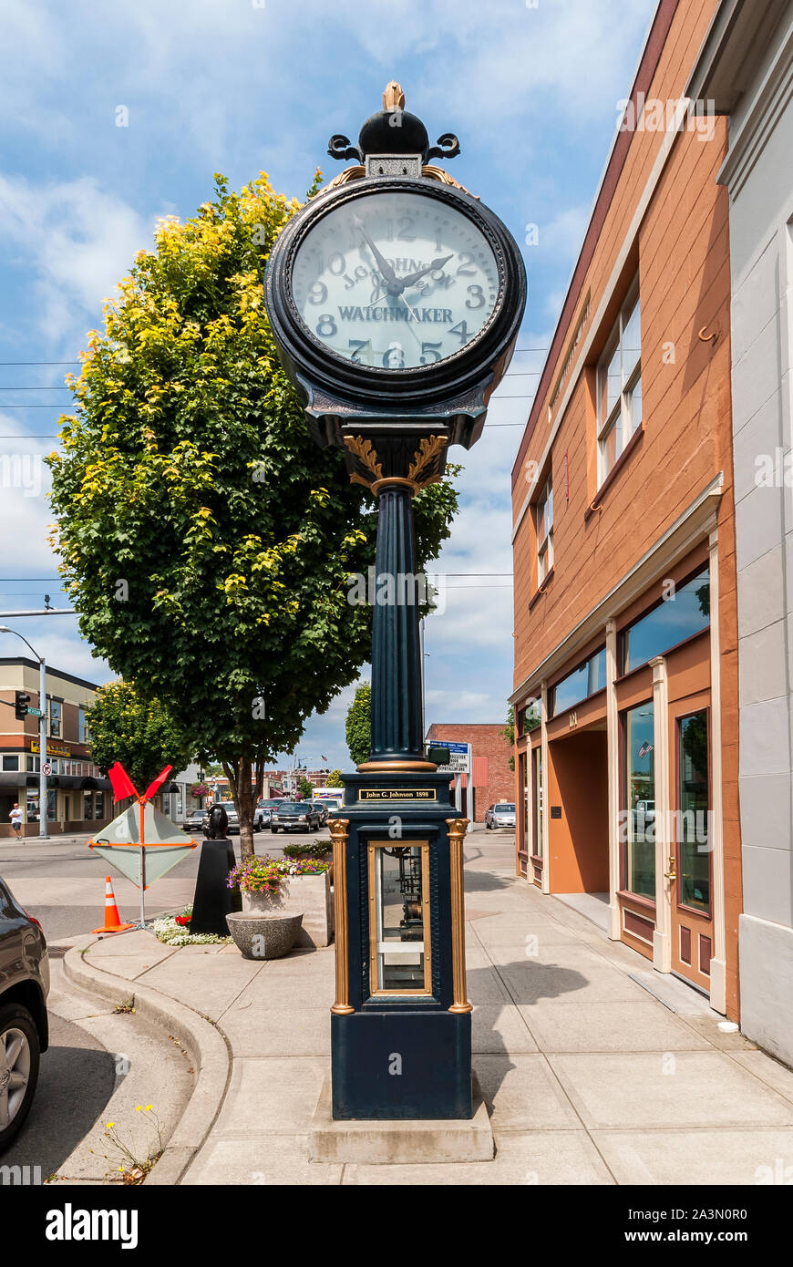 The outdoor John G. Johnson clock at 103  S. Meridian Way in Puyallup, Washington.  It is near Johnson Jewelers.  Clock has a date of 1898 on it. Stock Photo