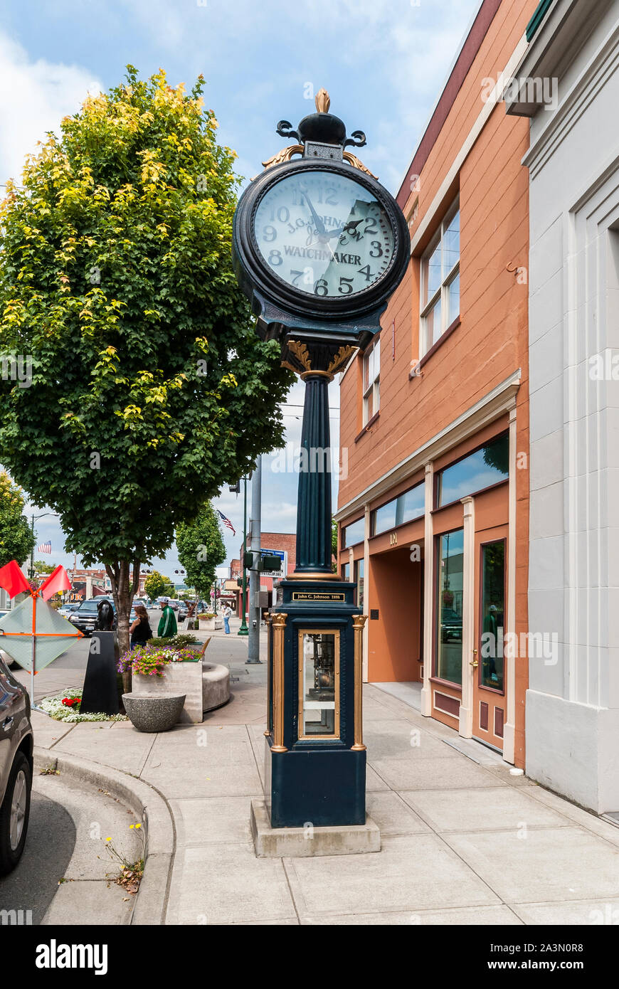 The outdoor John G. Johnson clock at 103  S. Meridian Way in Puyallup, Washington.  It is near Johnson Jewelers.  Clock has a date of 1898 on it. Stock Photo