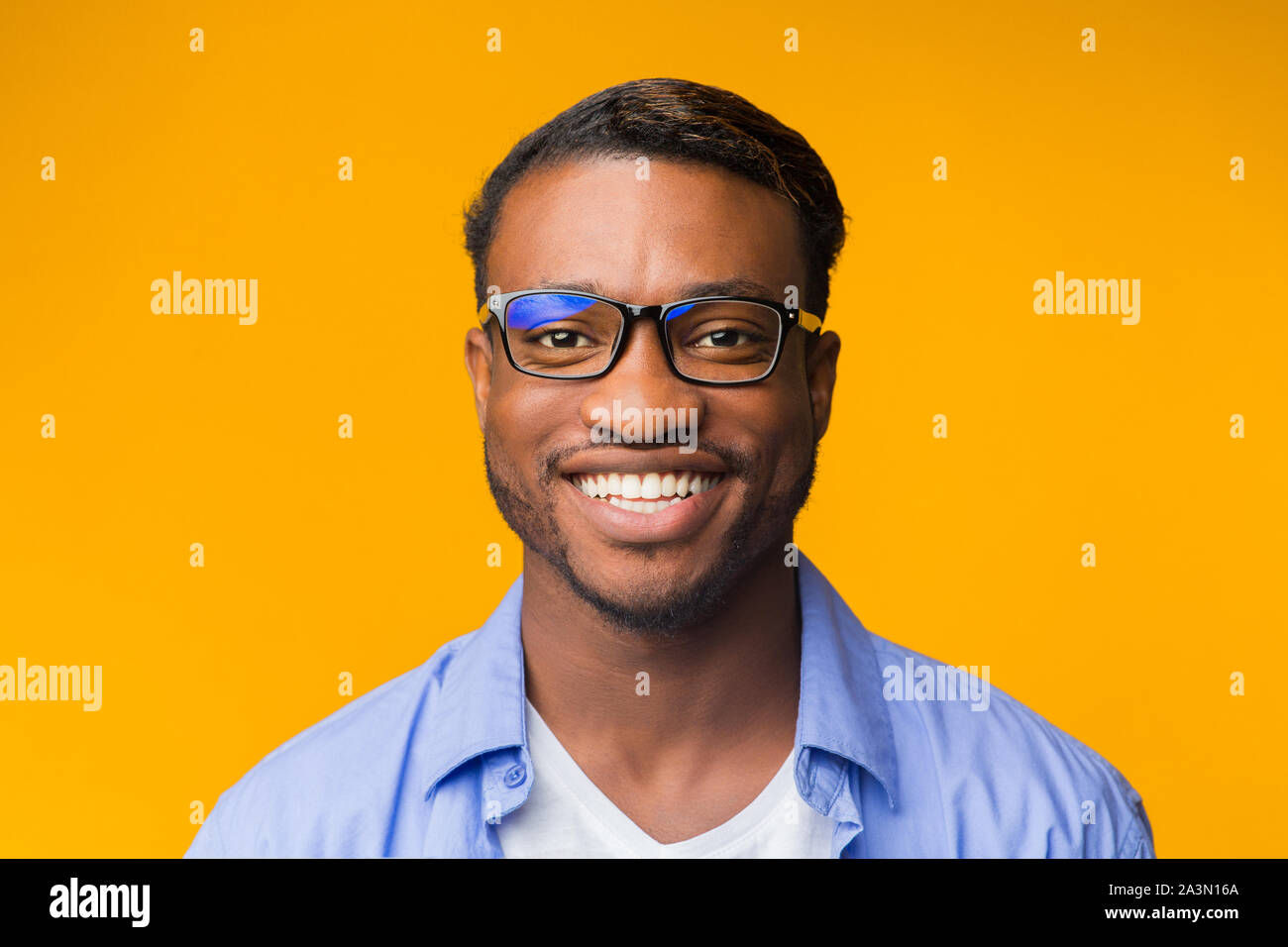 African American Man Smiling At Camera Posing Over Yellow Background ...