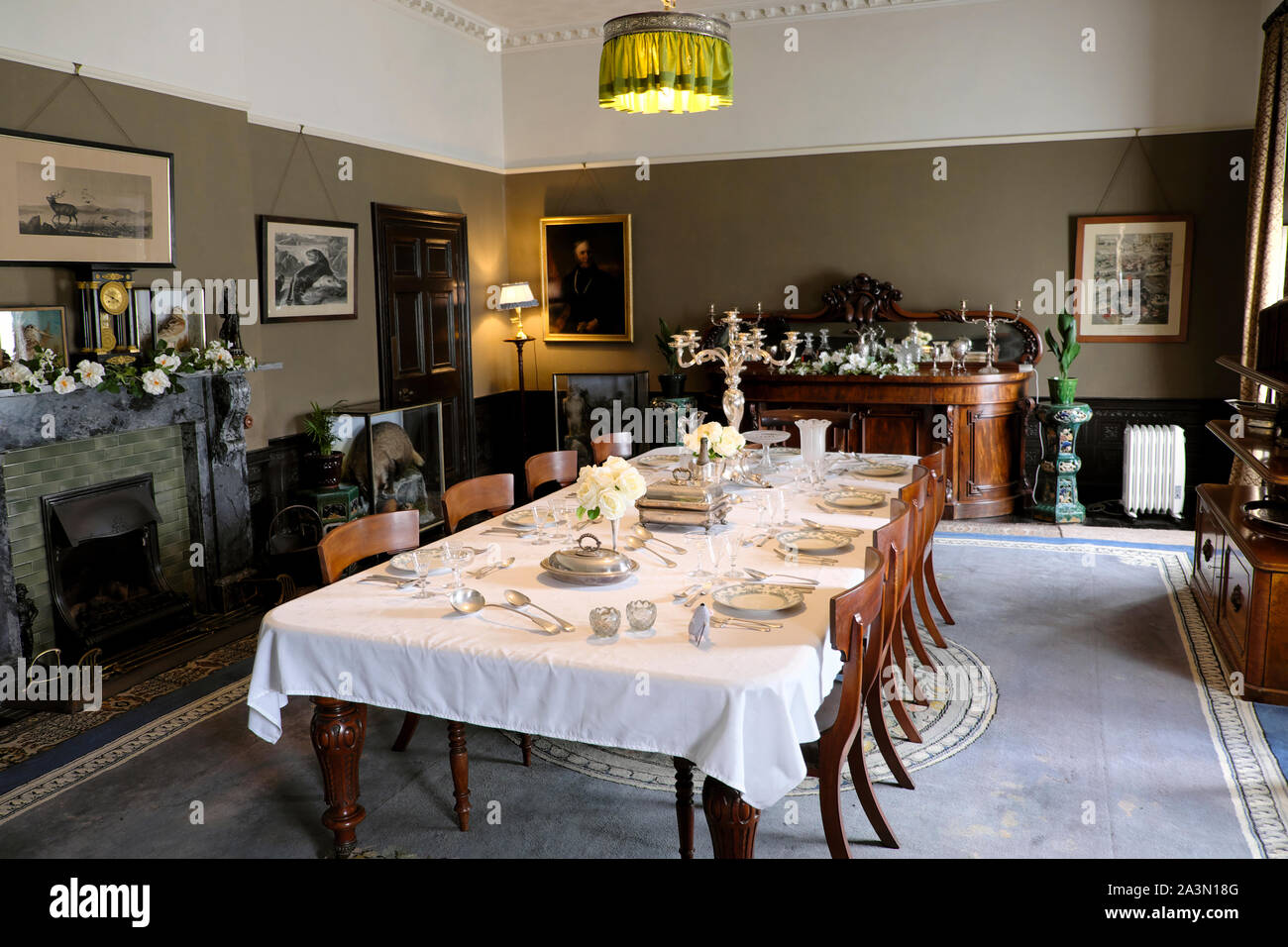 Dining room, furniture, table, chairs and setting inside house at Llanerchaeron in Ceredigion Wales UK   KATHY DEWITT Stock Photo