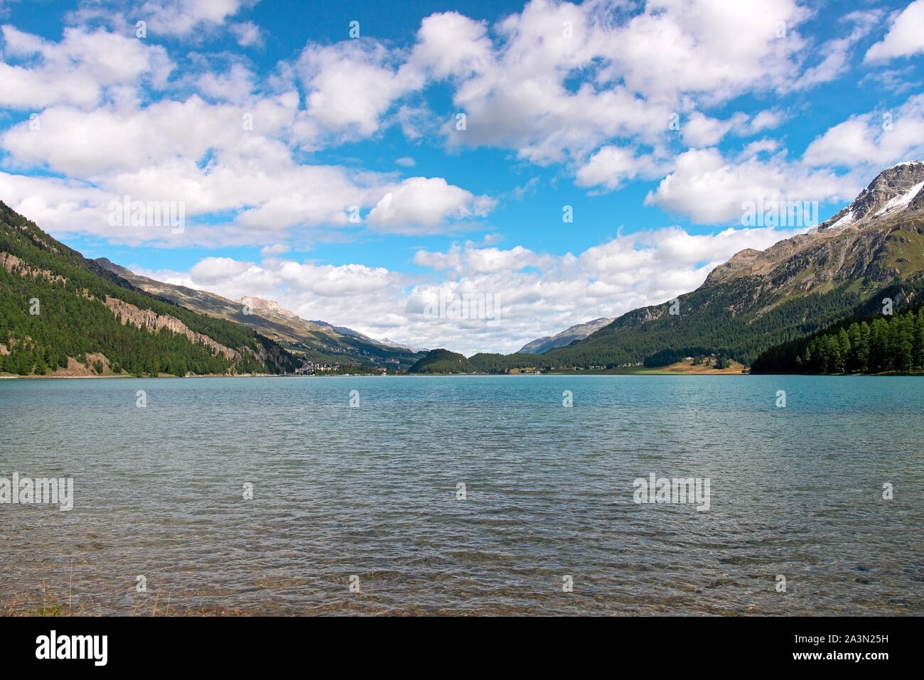 The village of Silvaplana is nestled in the wide lake plateau of the Upper Engadine. Stock Photo