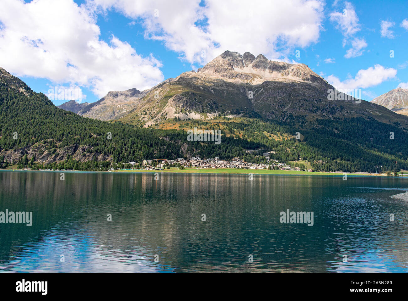 The village of Silvaplana is nestled in the wide lake plateau of the Upper Engadine. Stock Photo