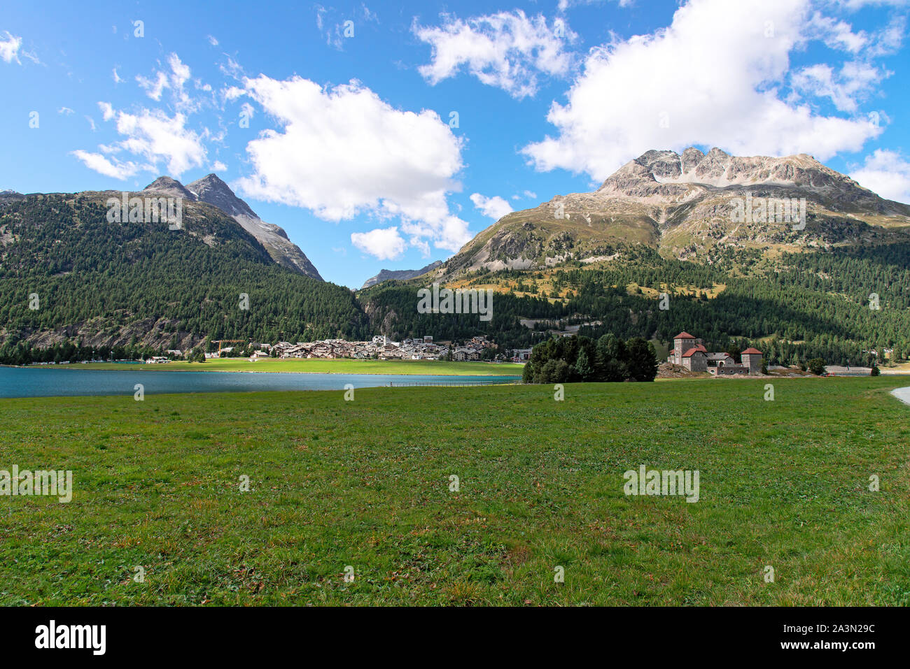 The village of Silvaplana is nestled in the wide lake plateau of the Upper Engadine. Stock Photo