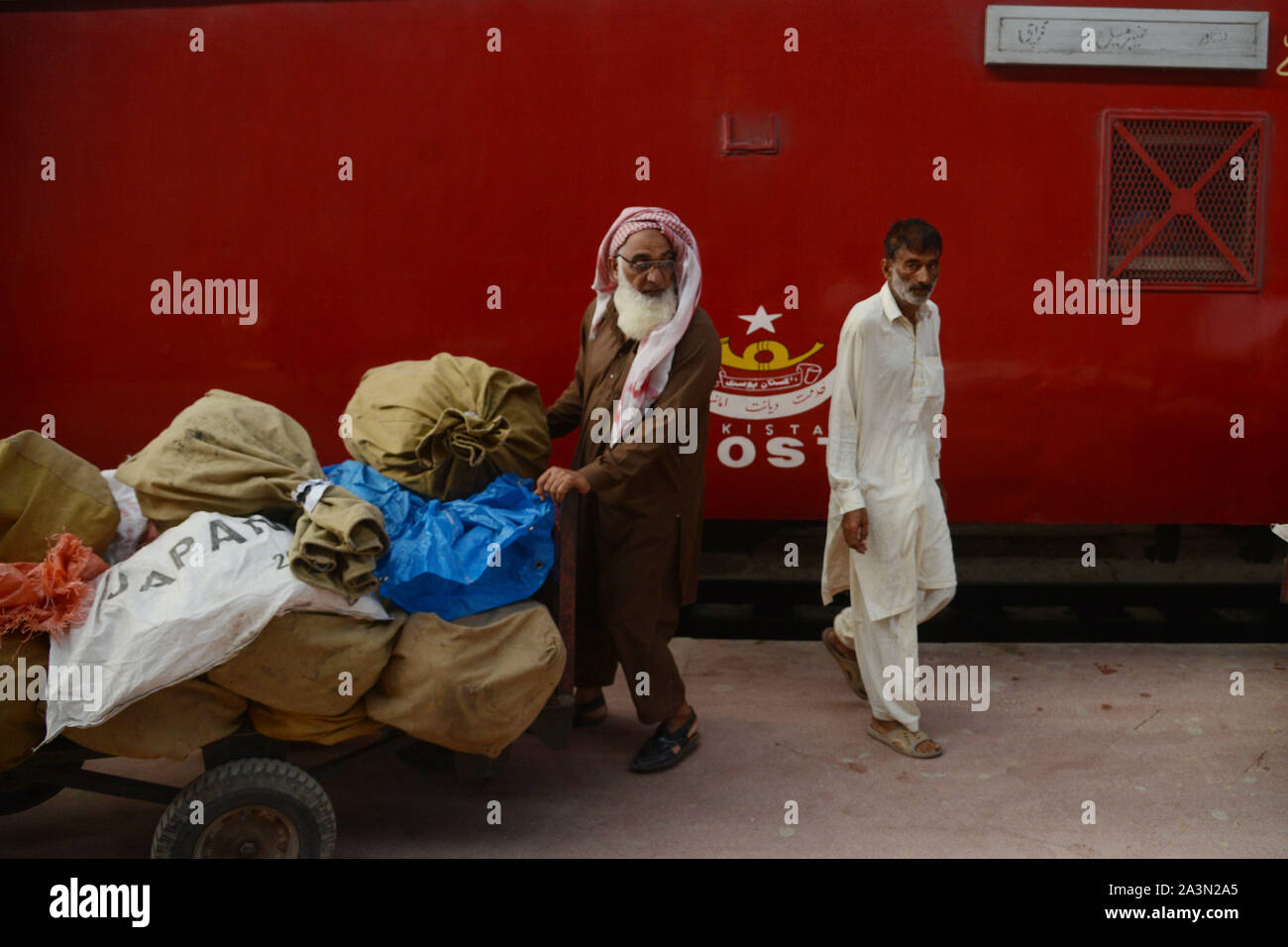 Pakistani Post Office Worker Sorts Mails After It Was Unloaded