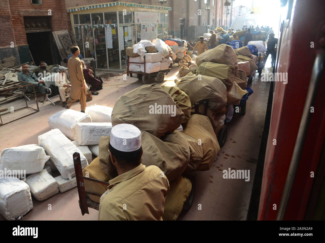 Pakistani Post Office Worker Sorts Mails After It Was Unloaded