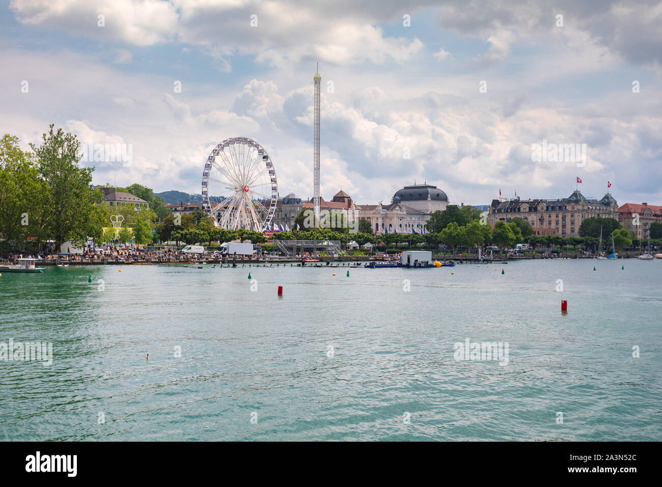 View with Lake Zurich with Opera house and  a Big round wheel in background. in Zurich city, Switzerland Stock Photo