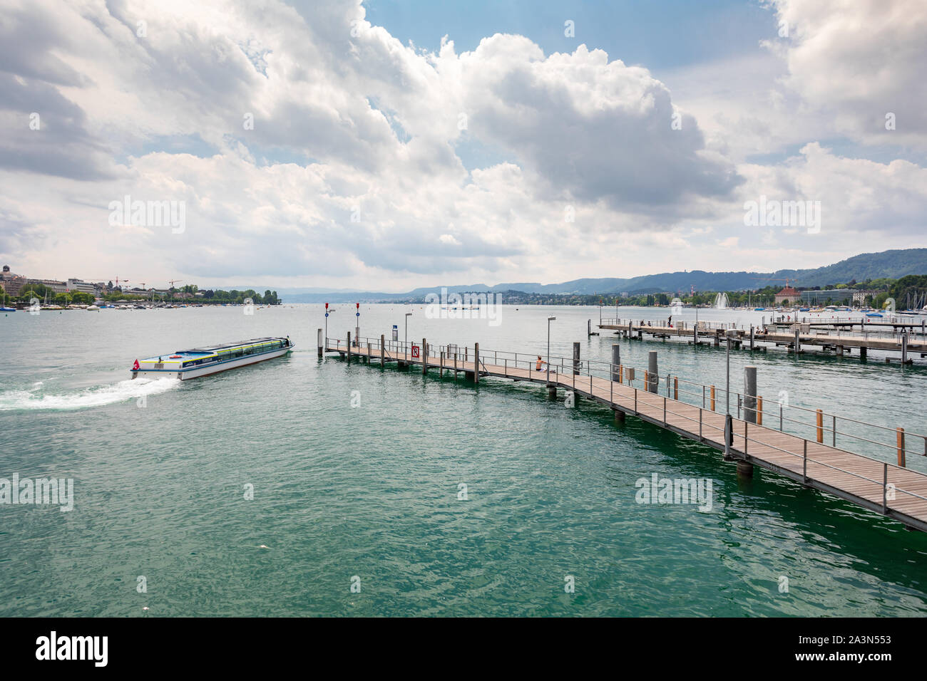 A big boat passing near the pontoons on Lake Zurich, Switzerland Stock Photo