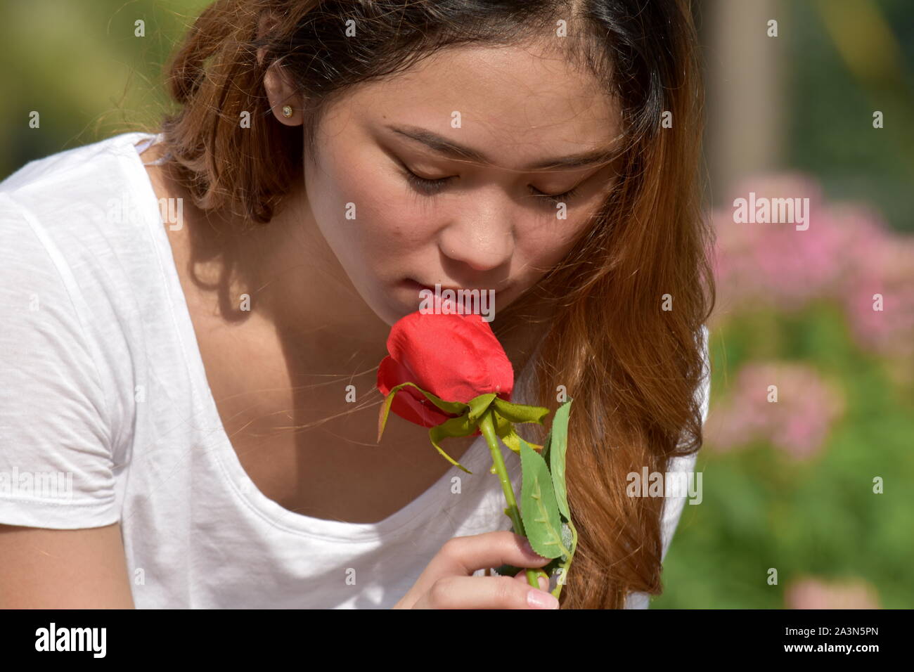 Depressed Female Woman With A Flower Stock Photo Alamy