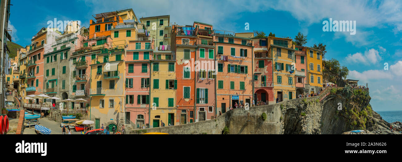 A panorama picture of the colorful buildings of the port area of Riomaggiore, Cinque Terre. Stock Photo