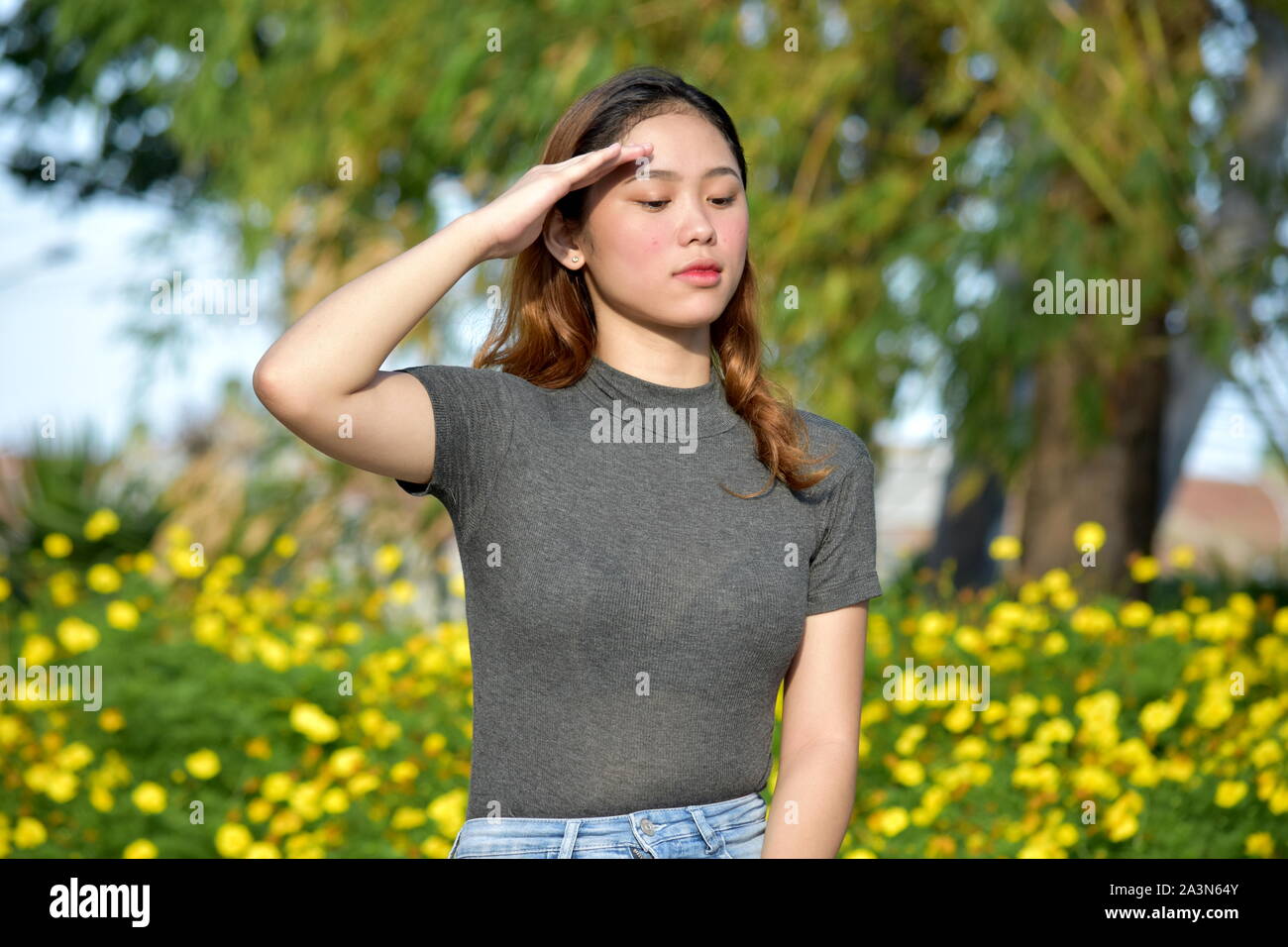 Young Female Saluting Stock Photo