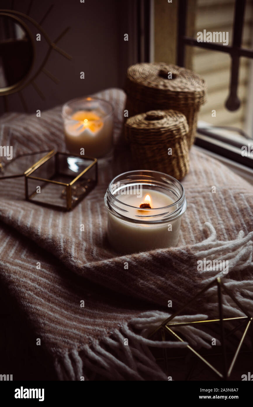 Burning hand-made candle with wooden wick in glass jar Stock Photo - Alamy