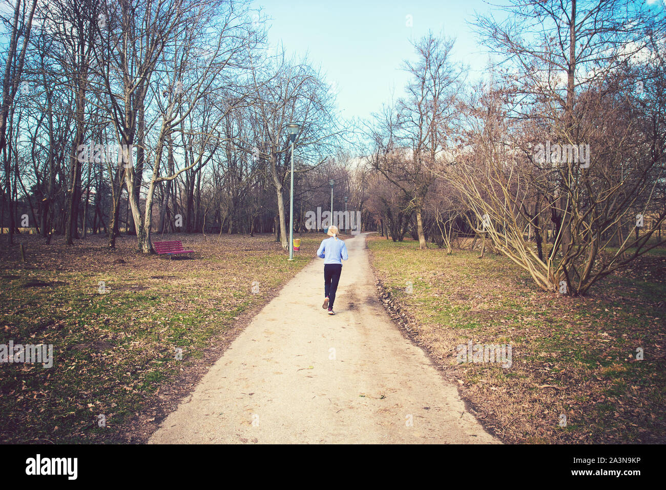 Back view woman jogging on hi-res stock photography and images - Alamy