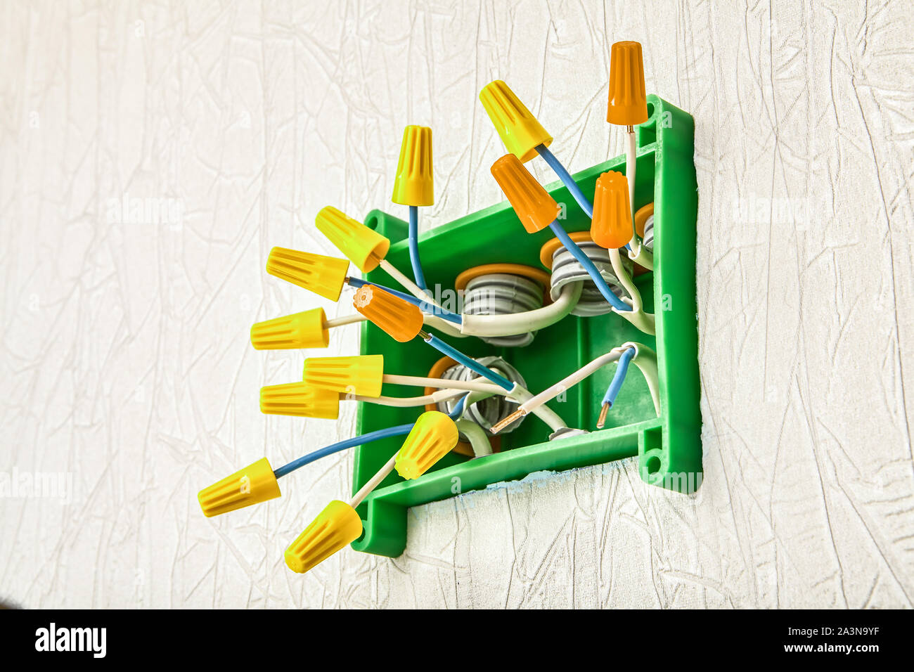 Insulated electrical twist nut connector for twisting electrical wires inside junction box in
