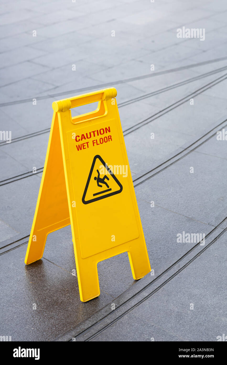 Warning stairs slippery wet sign hi-res stock photography and images