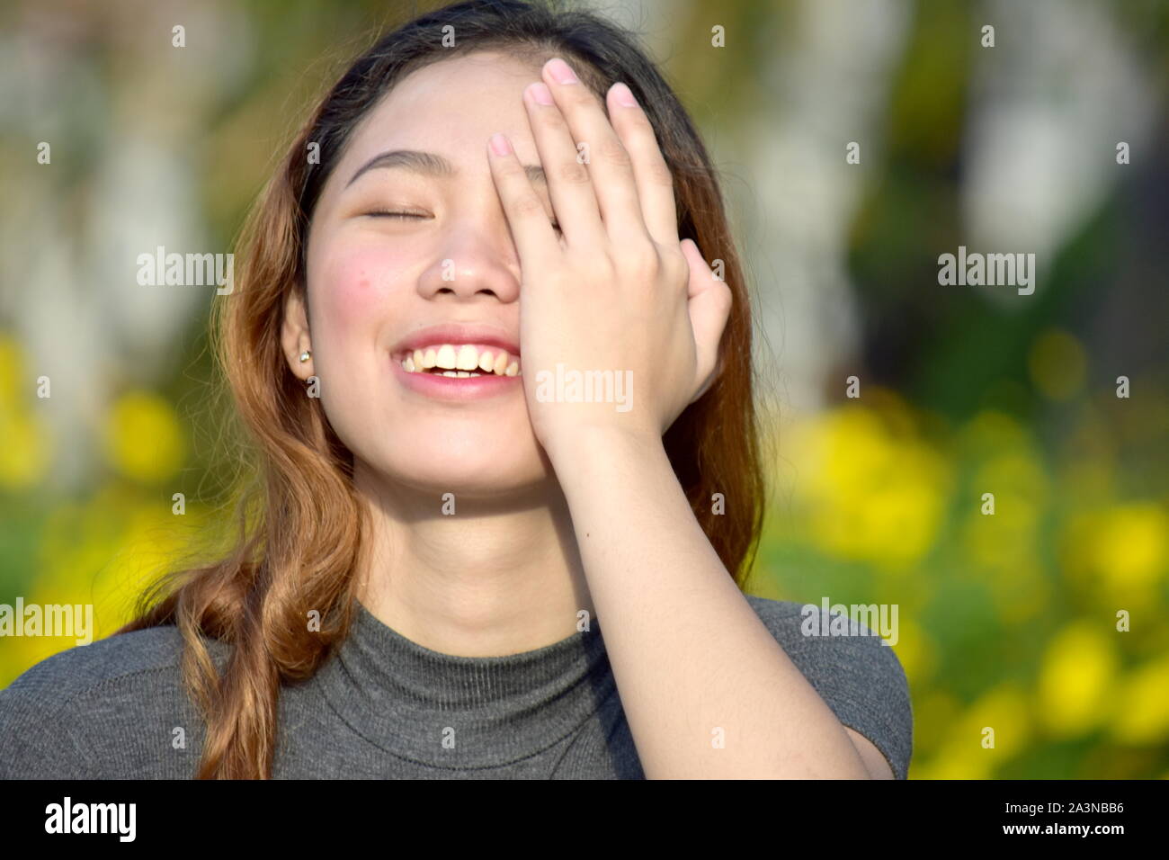 Young Filipina Woman And Laughter Stock Photo