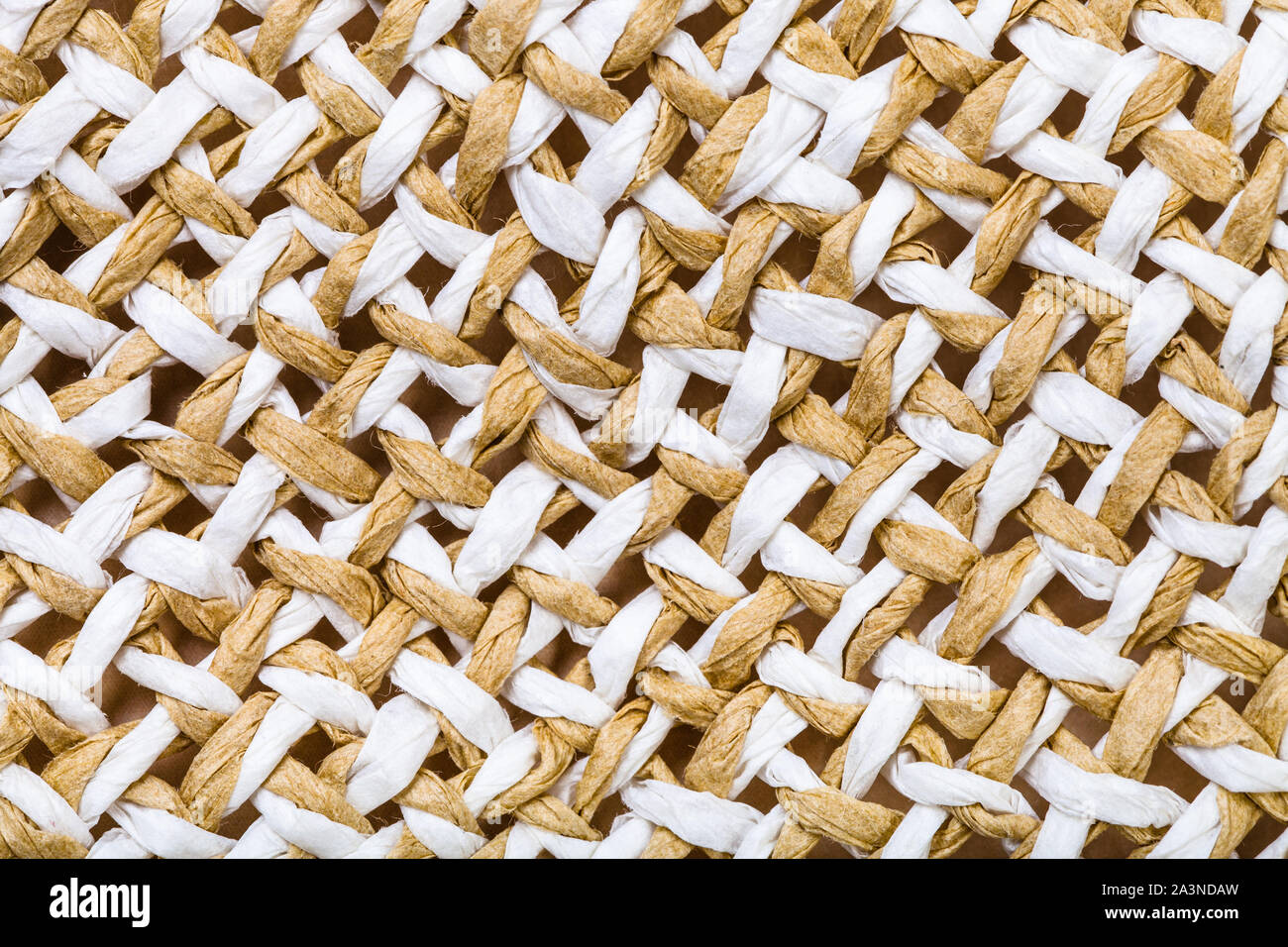 textile background - detail of summer straw hat from interwoven toyo fibers close up Stock Photo
