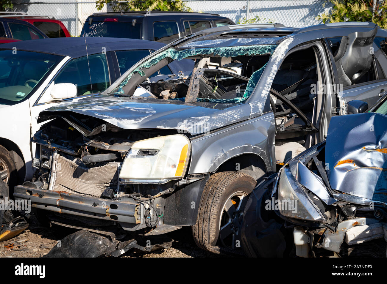 Total loss car after experiencing crash; extensive damage to frame