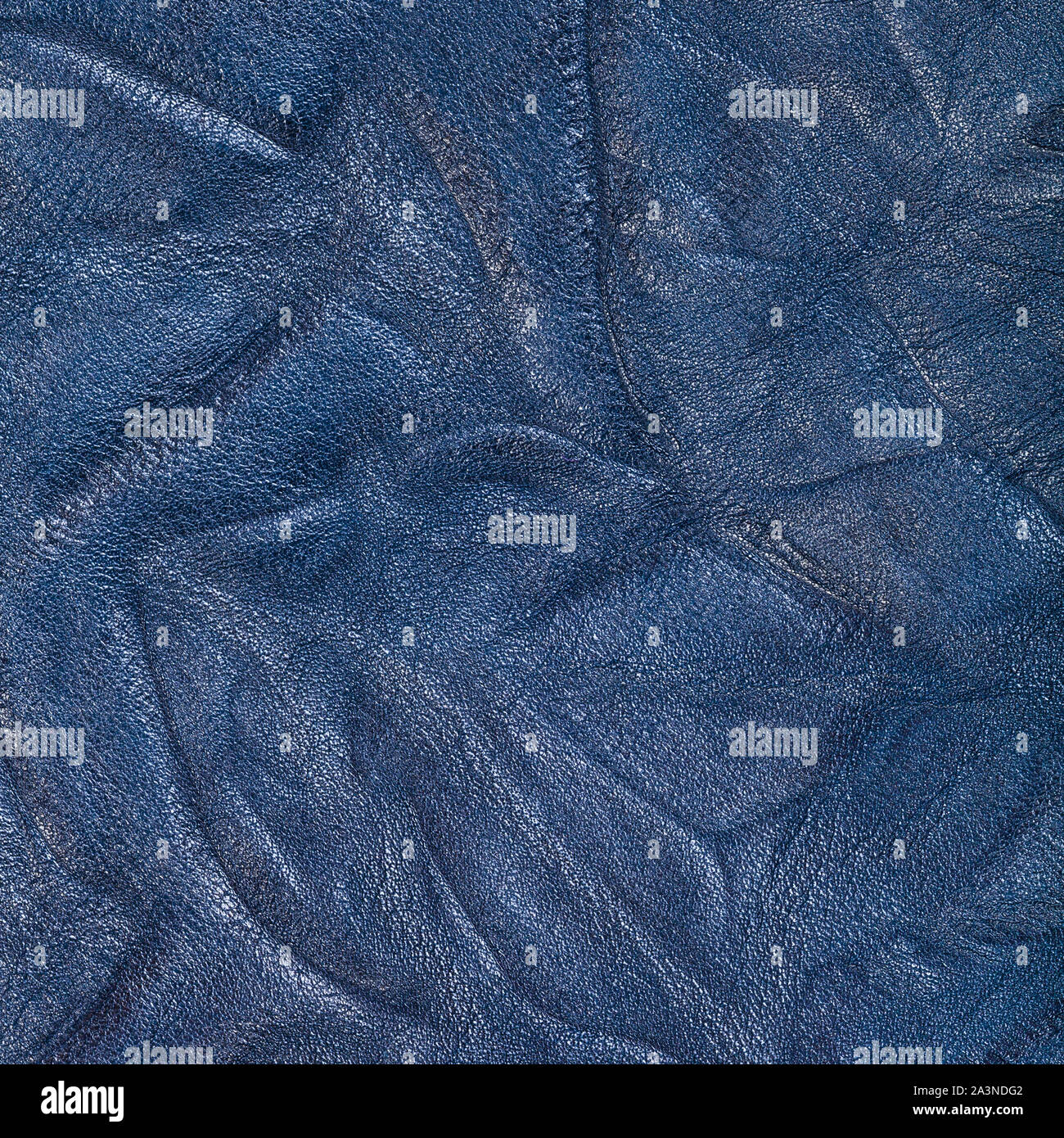 textured square background from blue crumpled leather close up Stock Photo