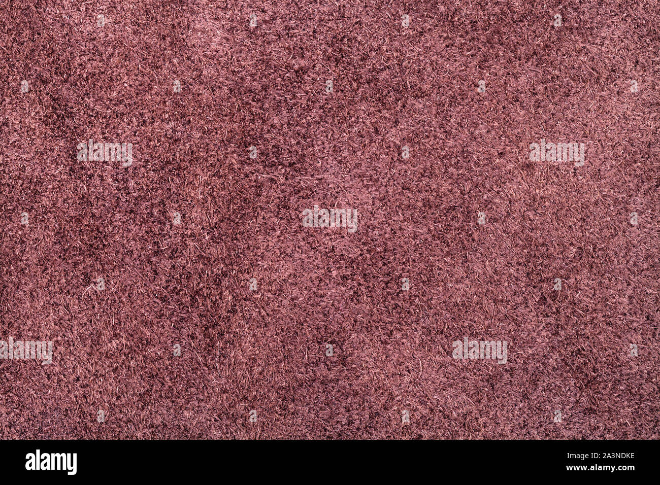 textured background from maroon brown suede close up Stock Photo