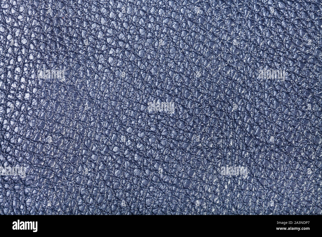 textured background from dark navy blue leather close up Stock Photo