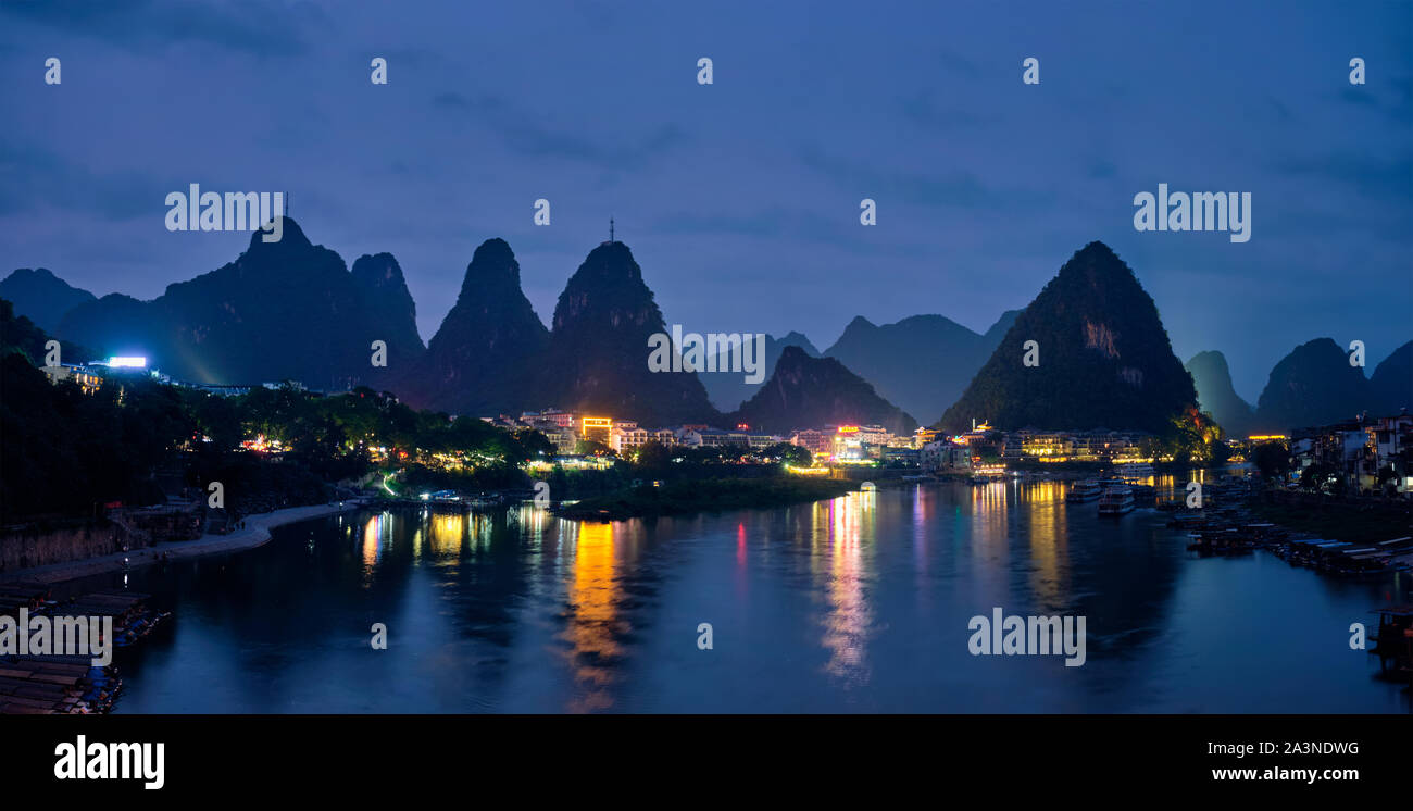 Yangshuo town illuminated in the evening, China Stock Photo