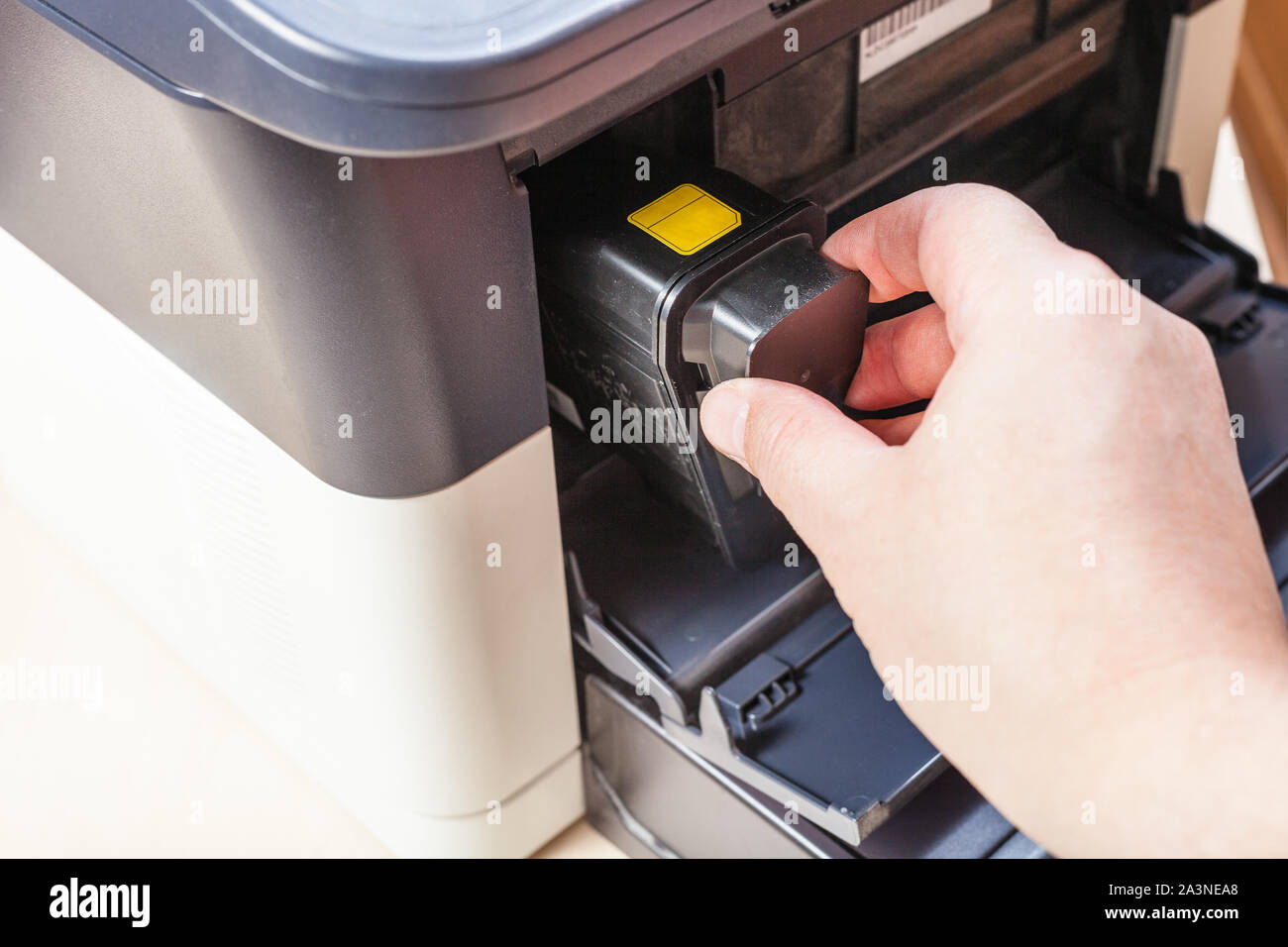replacement of toner cartridge in laser multi function device in office Stock Photo