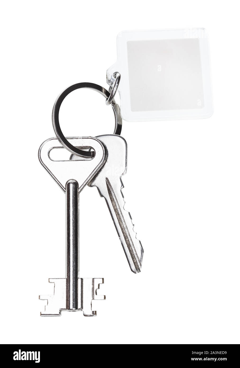 pair of door keys on keyring with blank keychain isolated on white