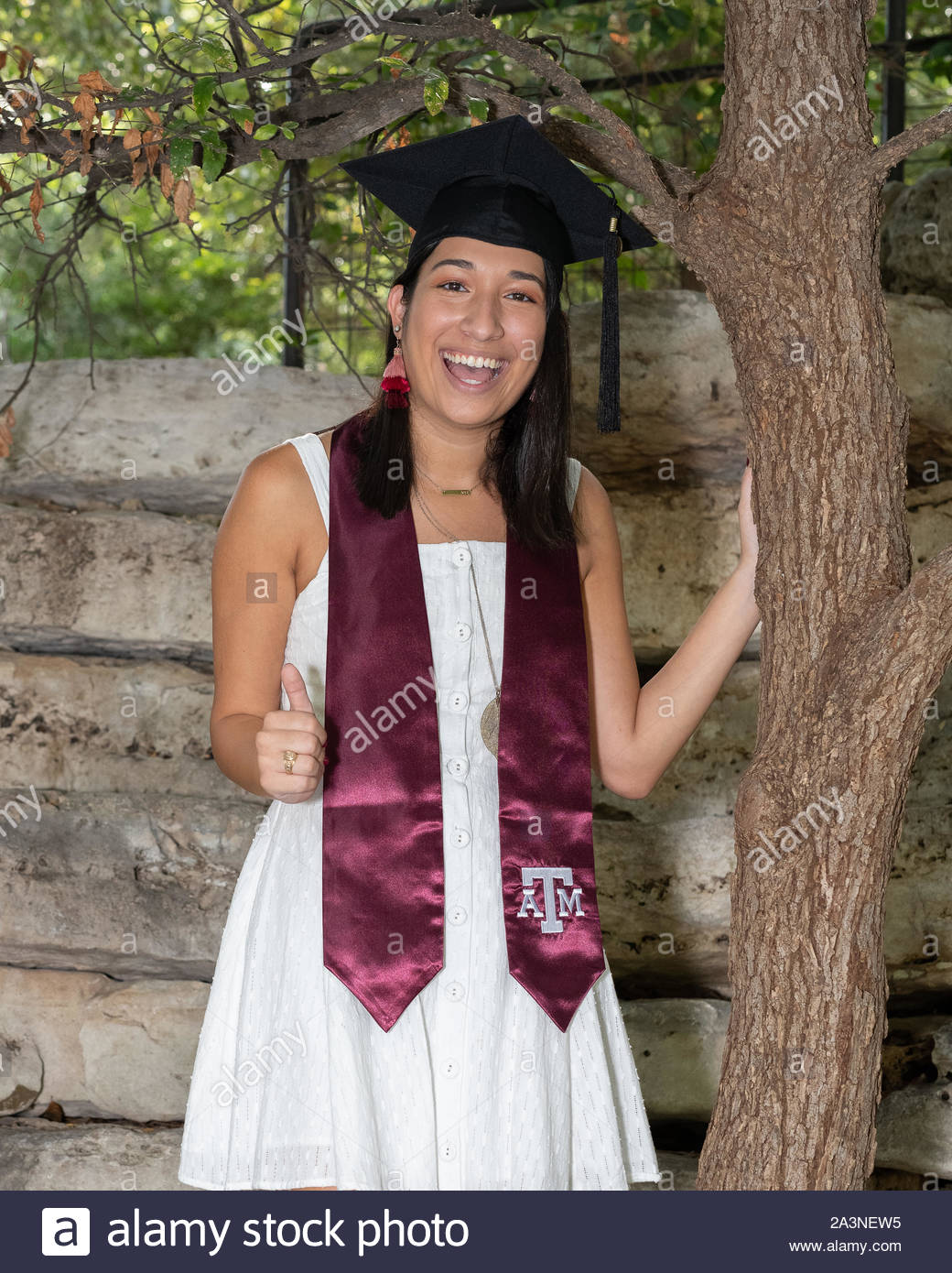 Young College girl celebrating her graduation from the University Stock Photo
