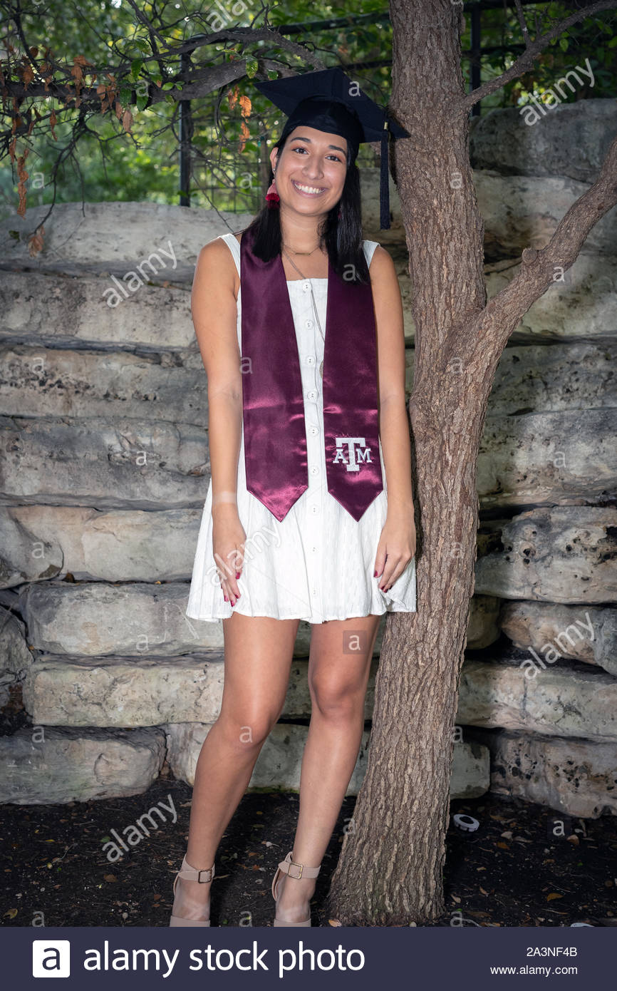 Young College girl celebrating her graduation from the University Stock Photo