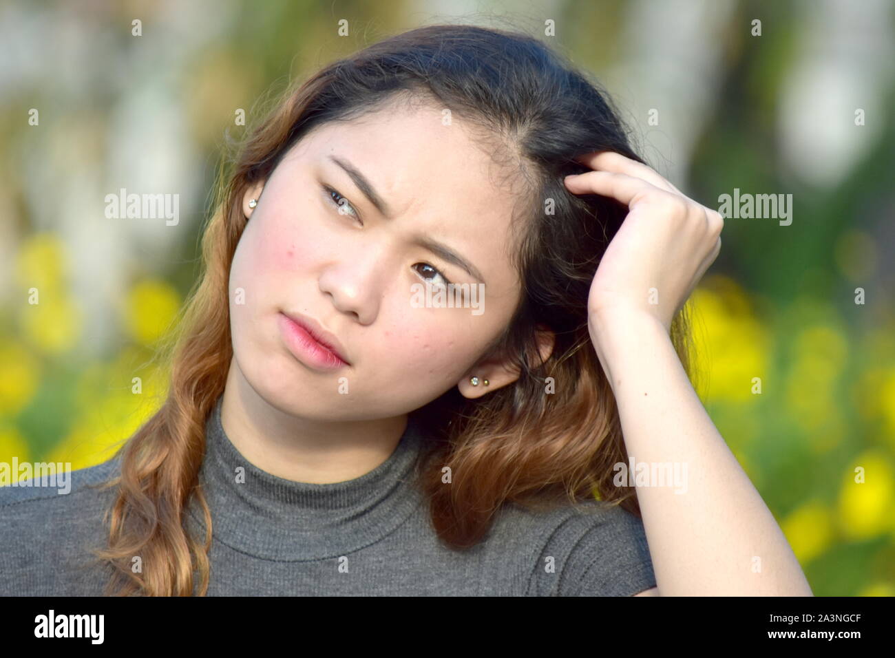 Young Female And Confusion Stock Photo