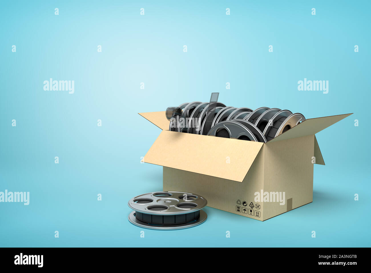 3d rendering of cardboard box full of film reels with one reel beside box on light-blue background with copy space. Stock Photo