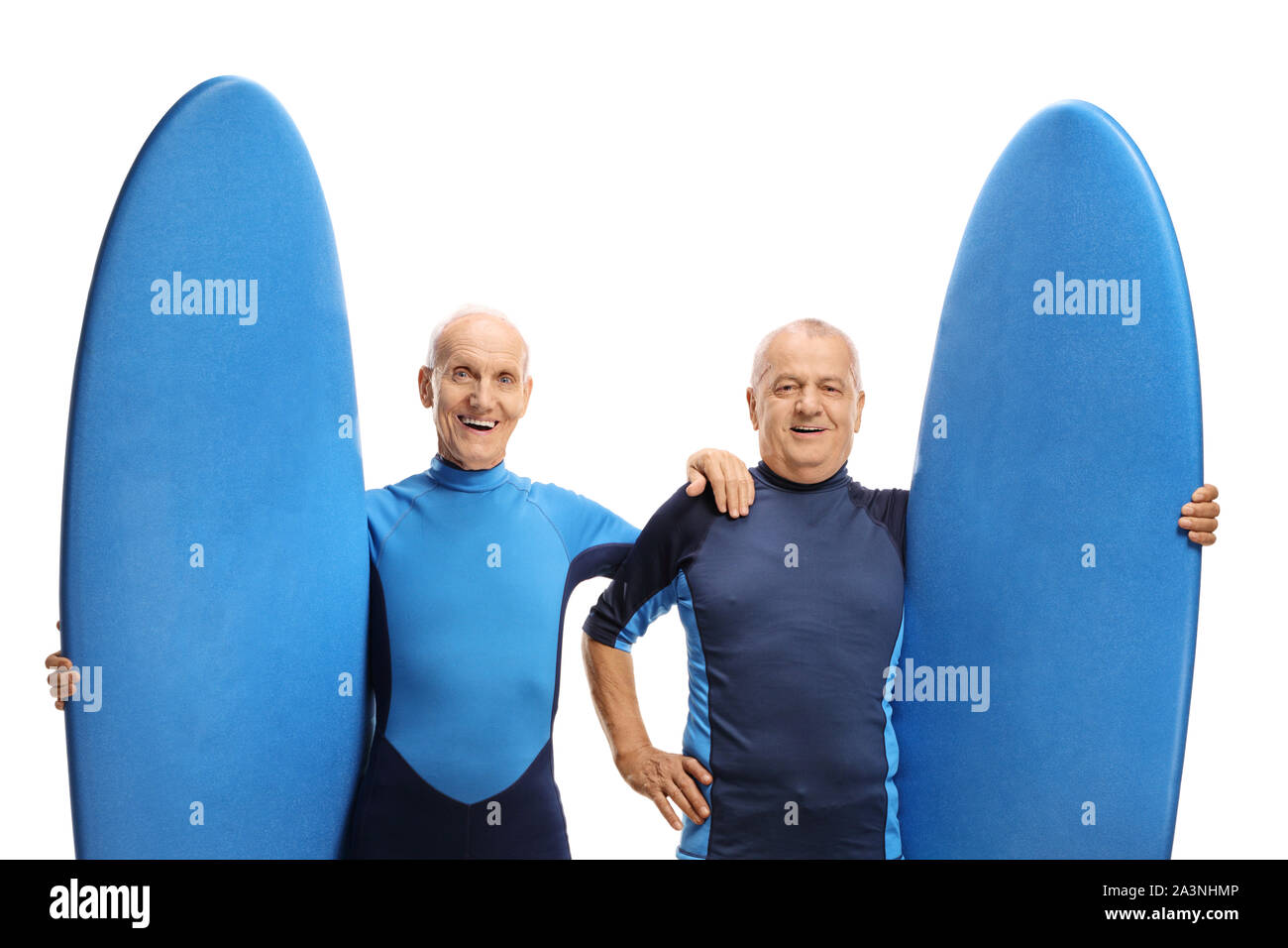 Two elderly men with surfboards isolated on white background Stock Photo