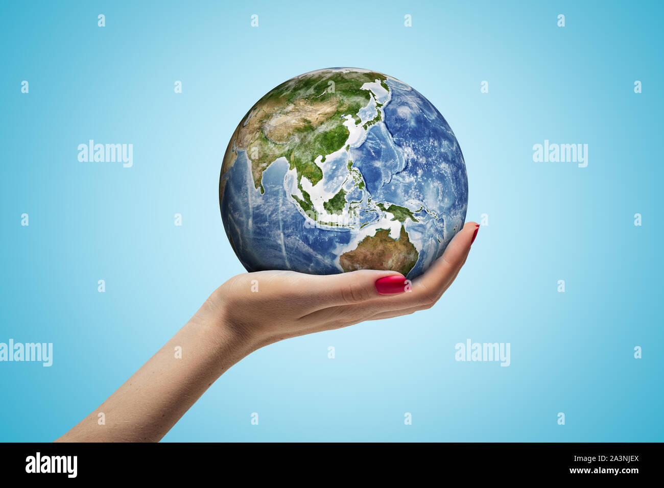Woman holding up world globe hi-res stock photography and images - Alamy