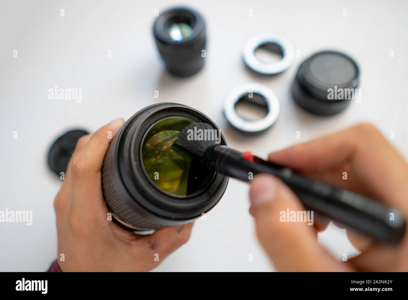 top view of a master repair modern camera equipment, cleaning dust on