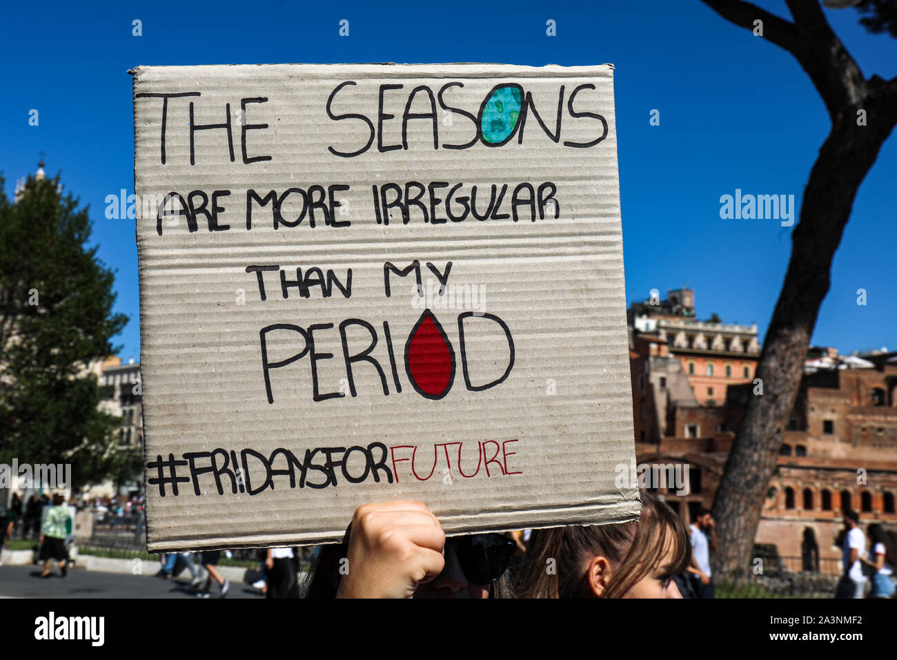 'The seasons are more irregular than my period' -placard. Fridays for future. School strike for climate. 27 Sep 2019. Rome, Italy. Stock Photo