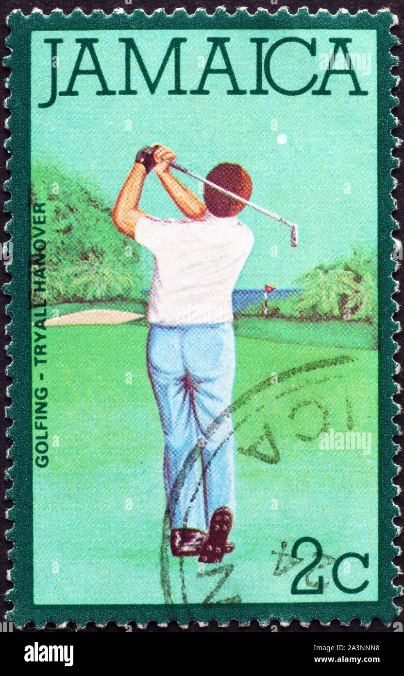 Golf player on jamaican postage stamp Stock Photo Alamy