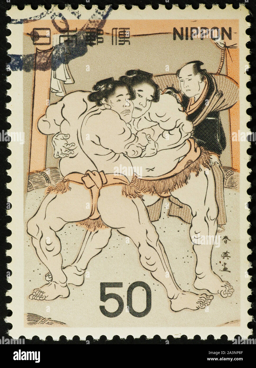 Japanese painting of Sumo wrestlers on postage stamp Stock Photo
