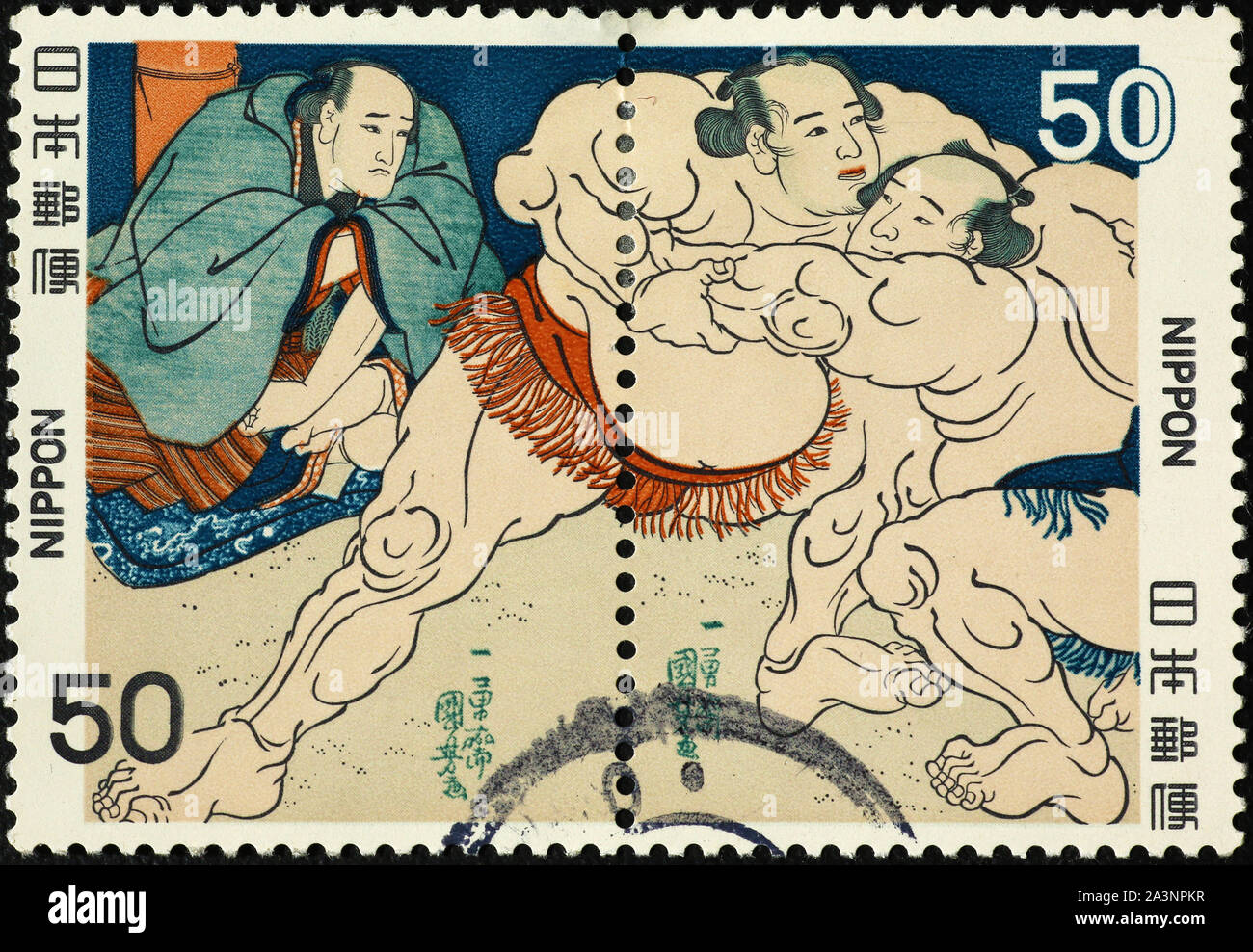 Sumo wrestlers on japanese postage stamps Stock Photo