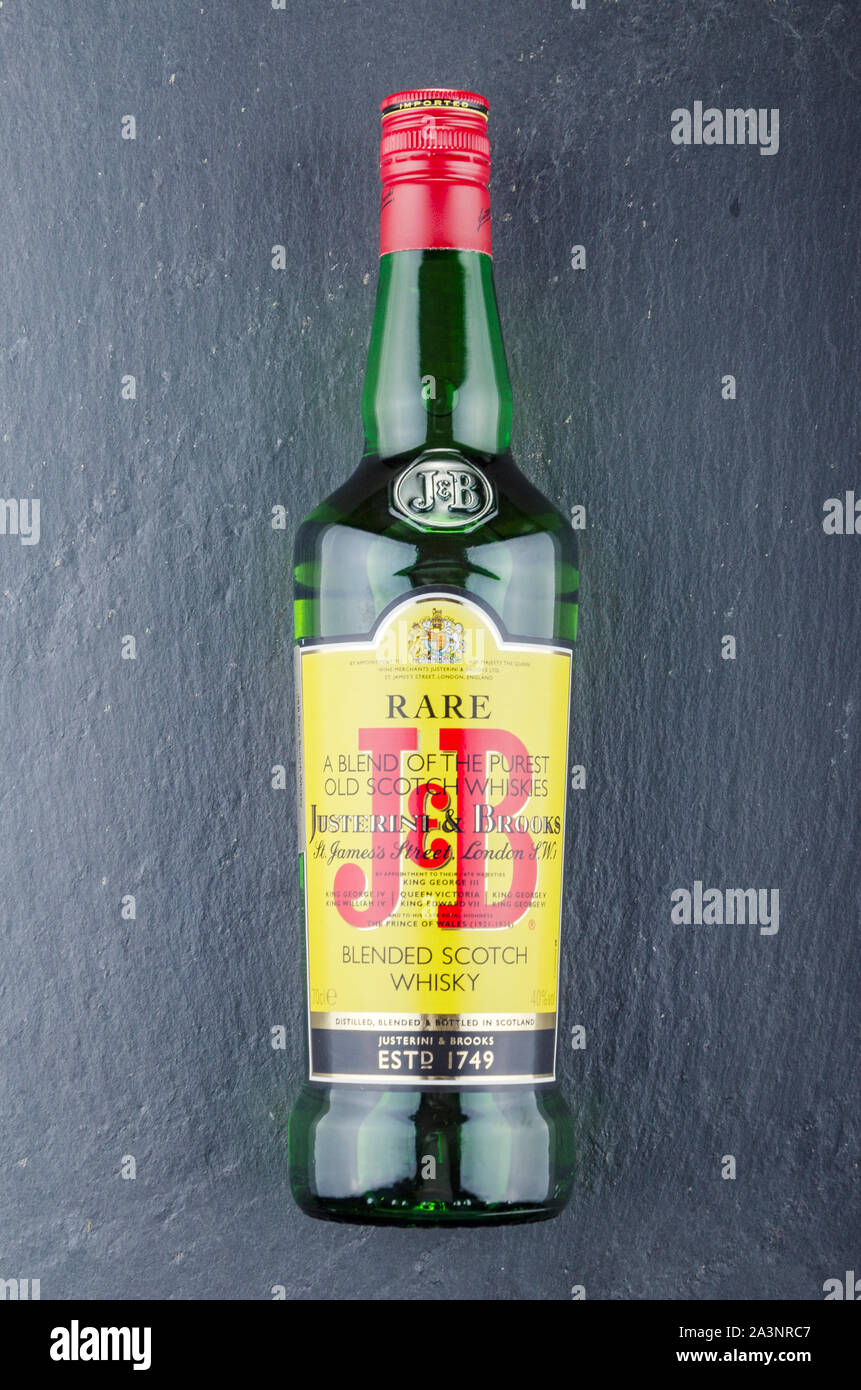 J&B blended scotch whisky on stone slate background. Justerini and