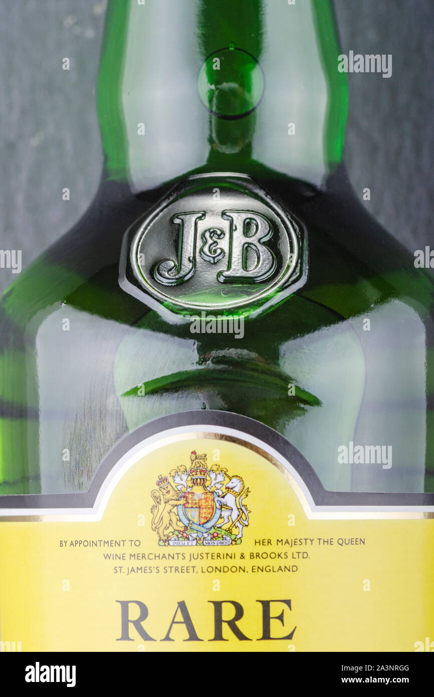 J&B blended scotch whisky on stone slate background. Justerini and