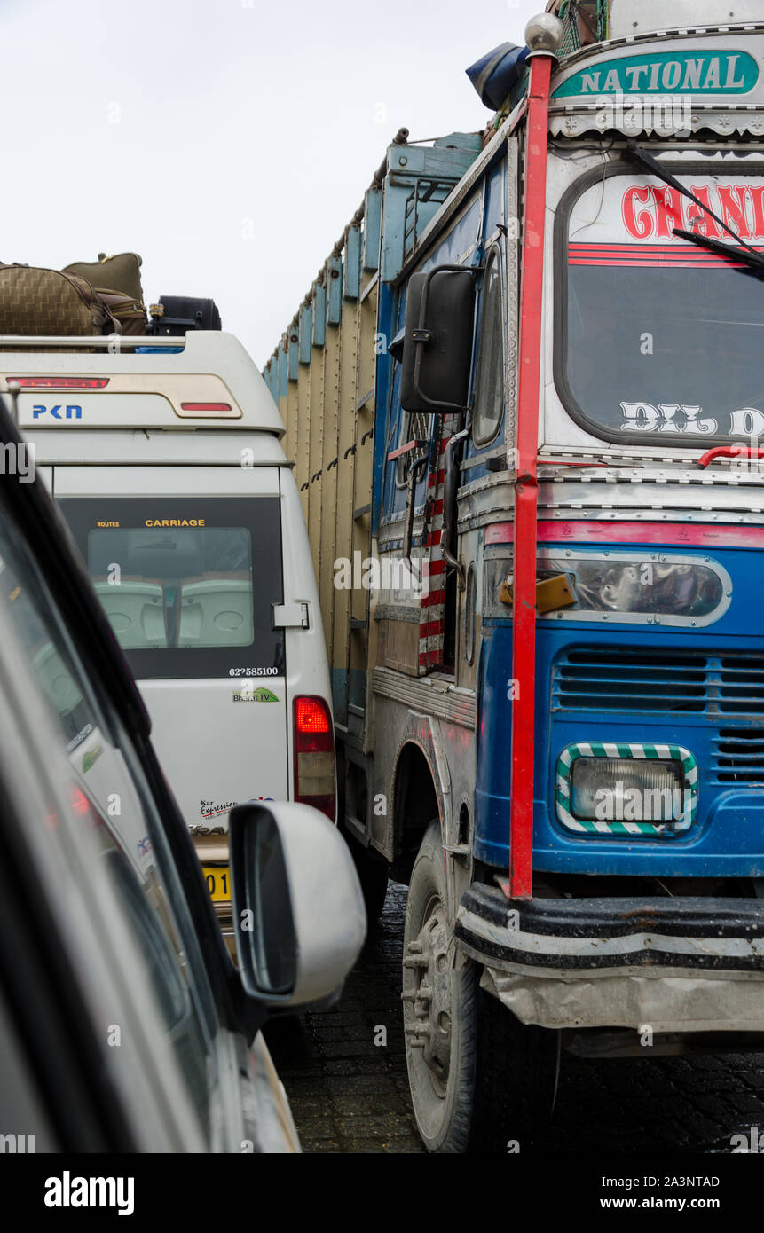 Traffic jams and extremely close crossing of trucks and vehicles due to