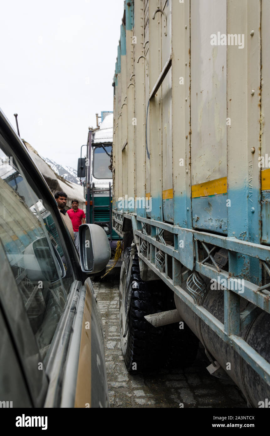 Traffic jams and extremely close crossing of trucks and vehicles due to