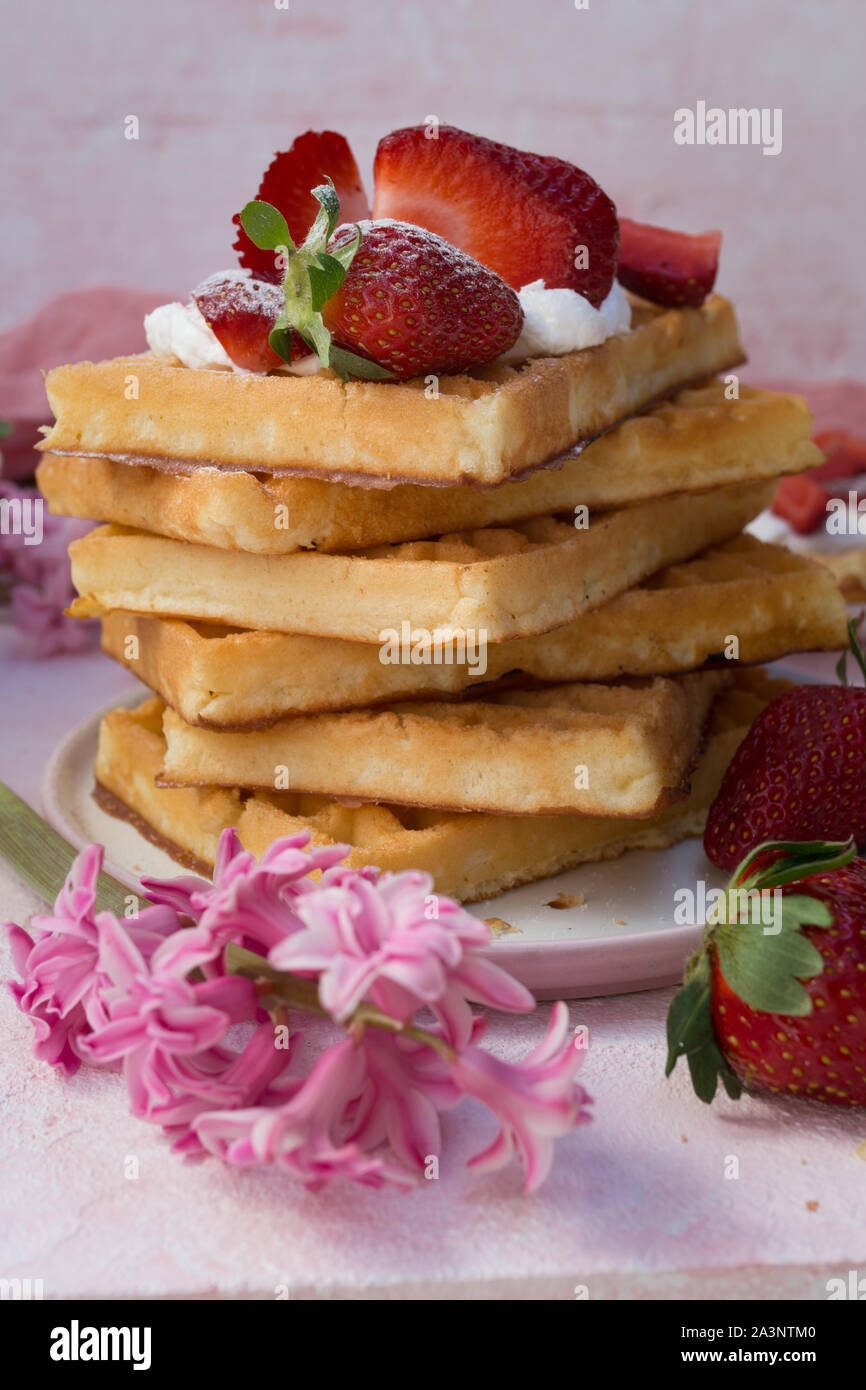 Waffles with strawberries and whipped cream Stock Photo - Alamy