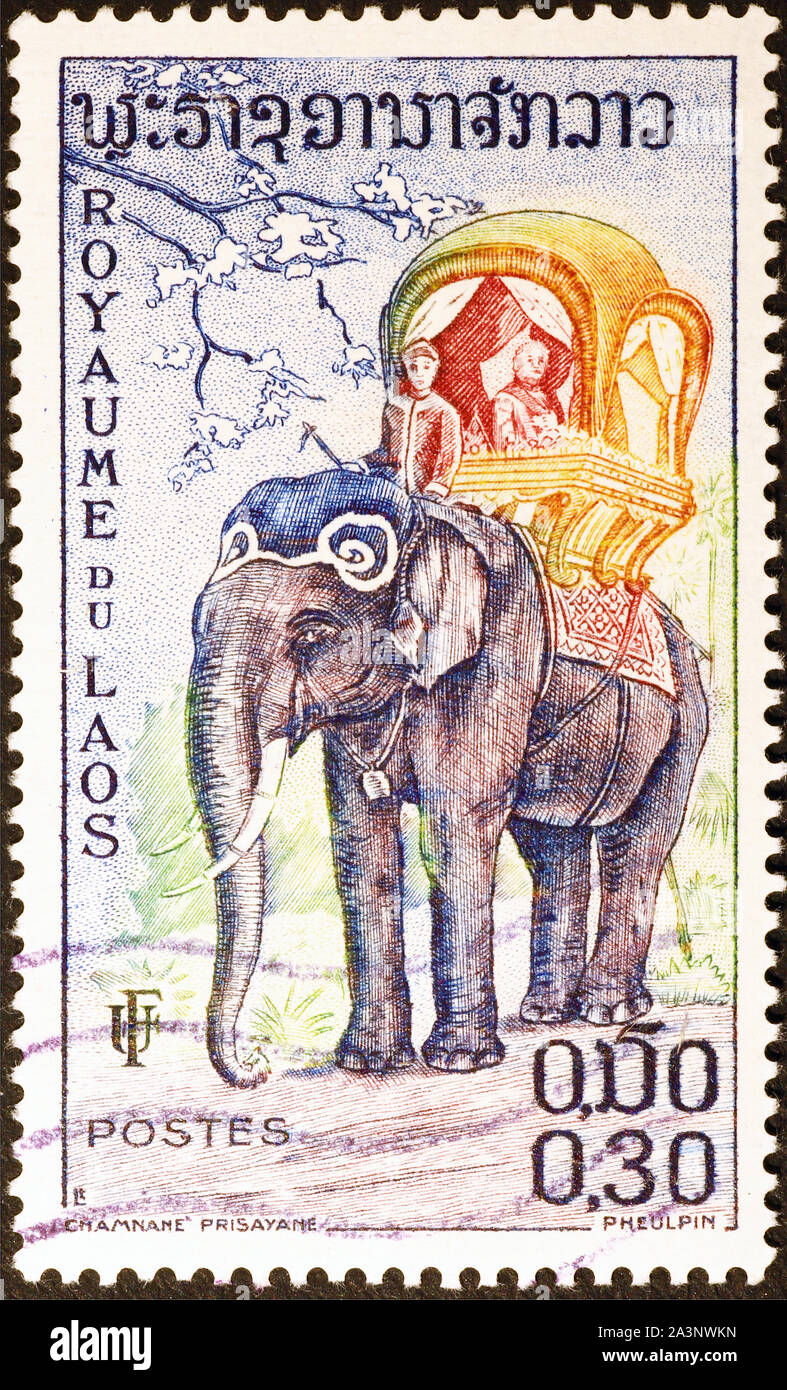 Elephant parade adorned on postage stamp of Laos Stock Photo